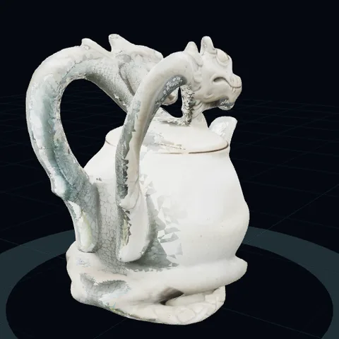 a teapot shaped like a dragon, front